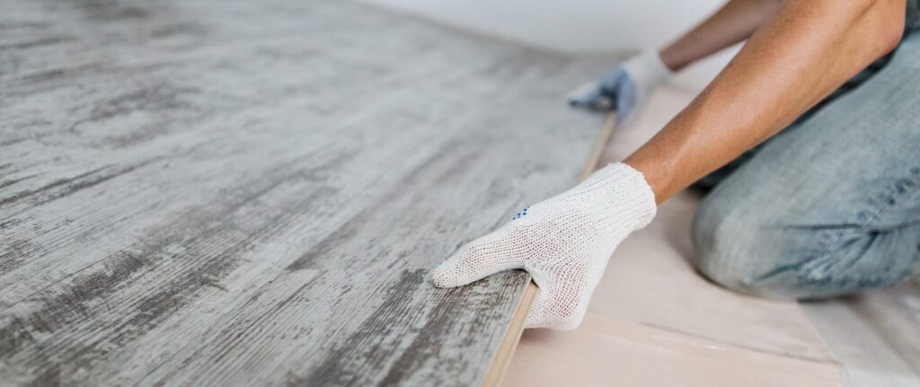 flooring contractor working on floor