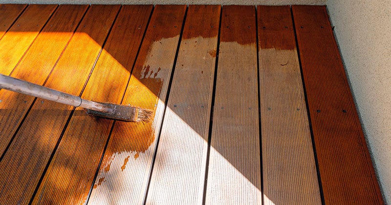 flooring contractor stains new wood floor