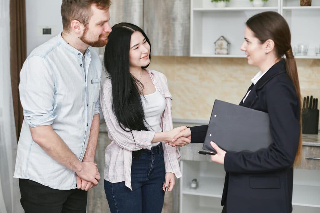 The clients meeting with a project manager discussing construction plans and the next project steps.
